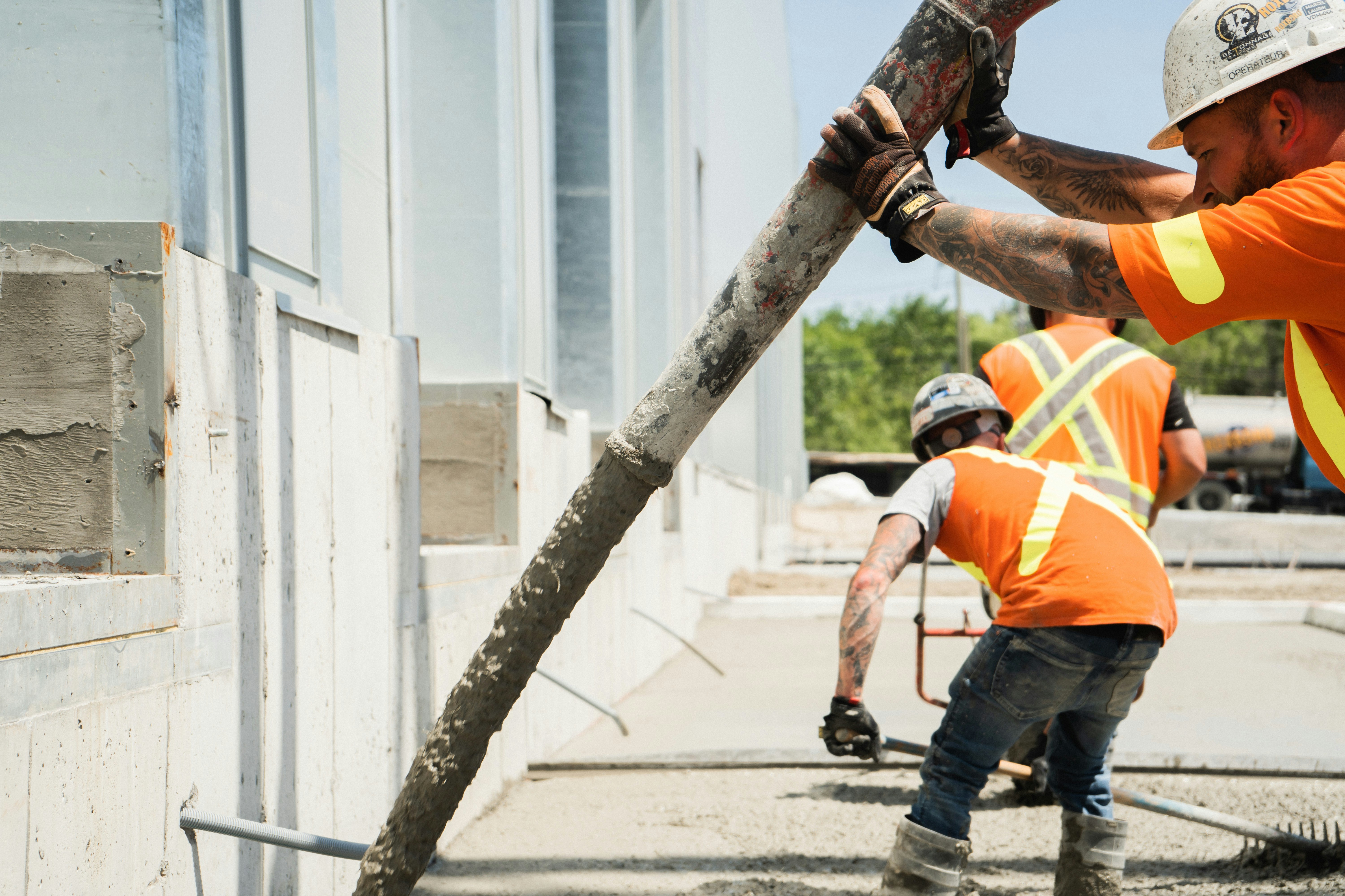 Worker holding concrete blocks